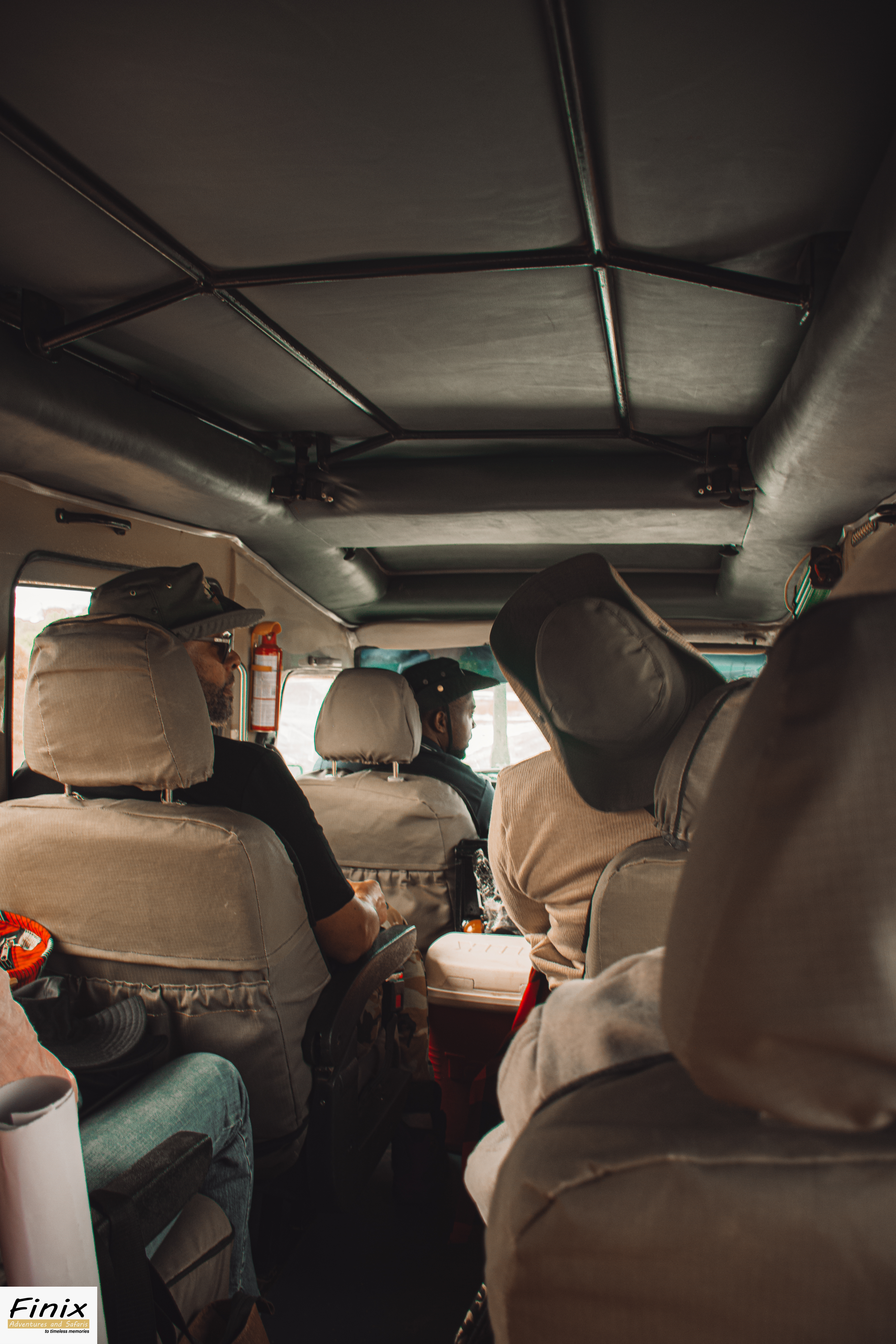 Safari essentials and seats inside a Maasai Mara game drive vehicle